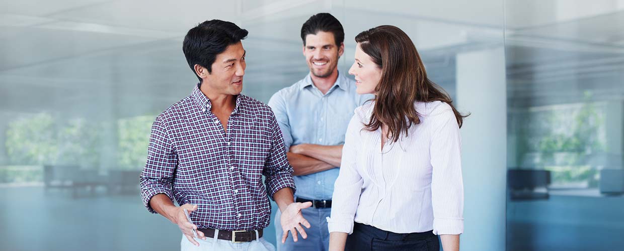 Business professionals demonstrating leadership, teamwork and workplace collaboration.